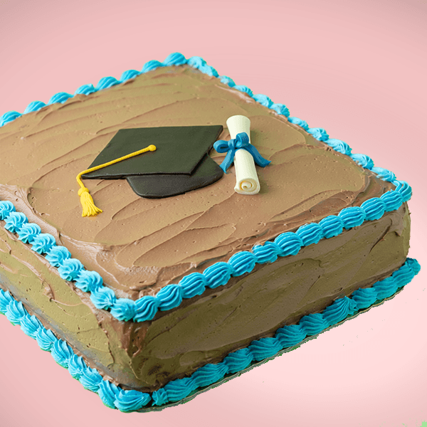 Chocolate graduation-themed cake with a fondant cap